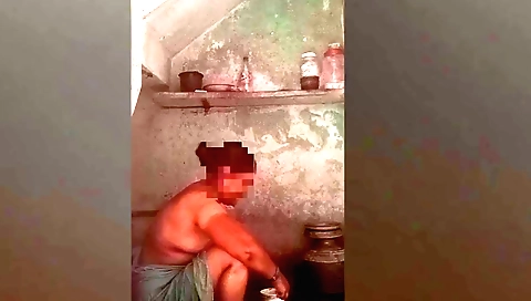 Indian solo female washes her clothes in the backyard