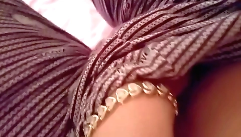 A sexy amateur indian girl is taking off her clothes