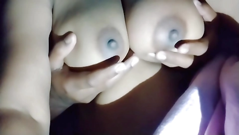 Indian slut masturbating with her big tits in the camera vid