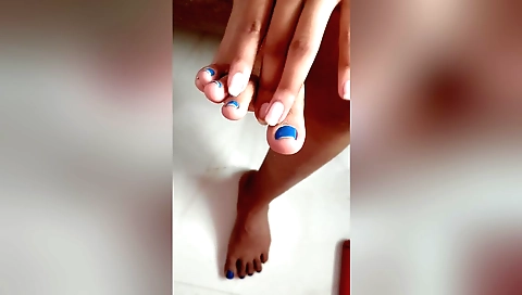 Foot fetish porn with a woman taking off her pants