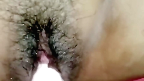 Indian hairy girl rides a toy and enjoys the experience