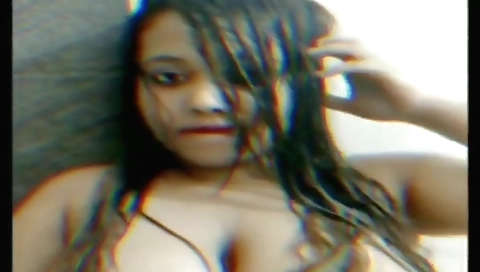 Big boobed naked brunette fingering her pussy at web camera