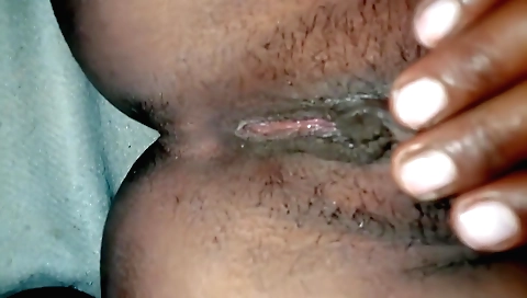 Indian girl is fingering her hairy pussy and pussy