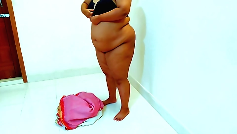 Charming Indian stepmom shows her tits in the dressing room