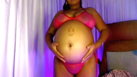 Indian brunette moves on her bed while her sexy ass is seen