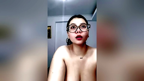 A cute brunette indian woman with a nice body is showing off