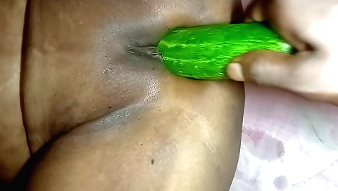 Indian boudi gets fucked in a doggy style with a cucumber