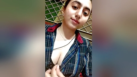 Sexy brunette shows her boobs in front of web camera