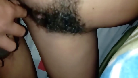Stepbrother plays with his hairy cunt during handjob