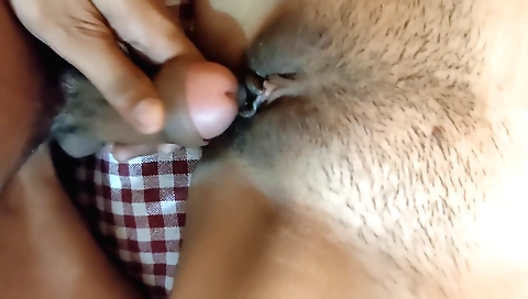 Indian whore in her bed giving her hairy pussy a blowjob